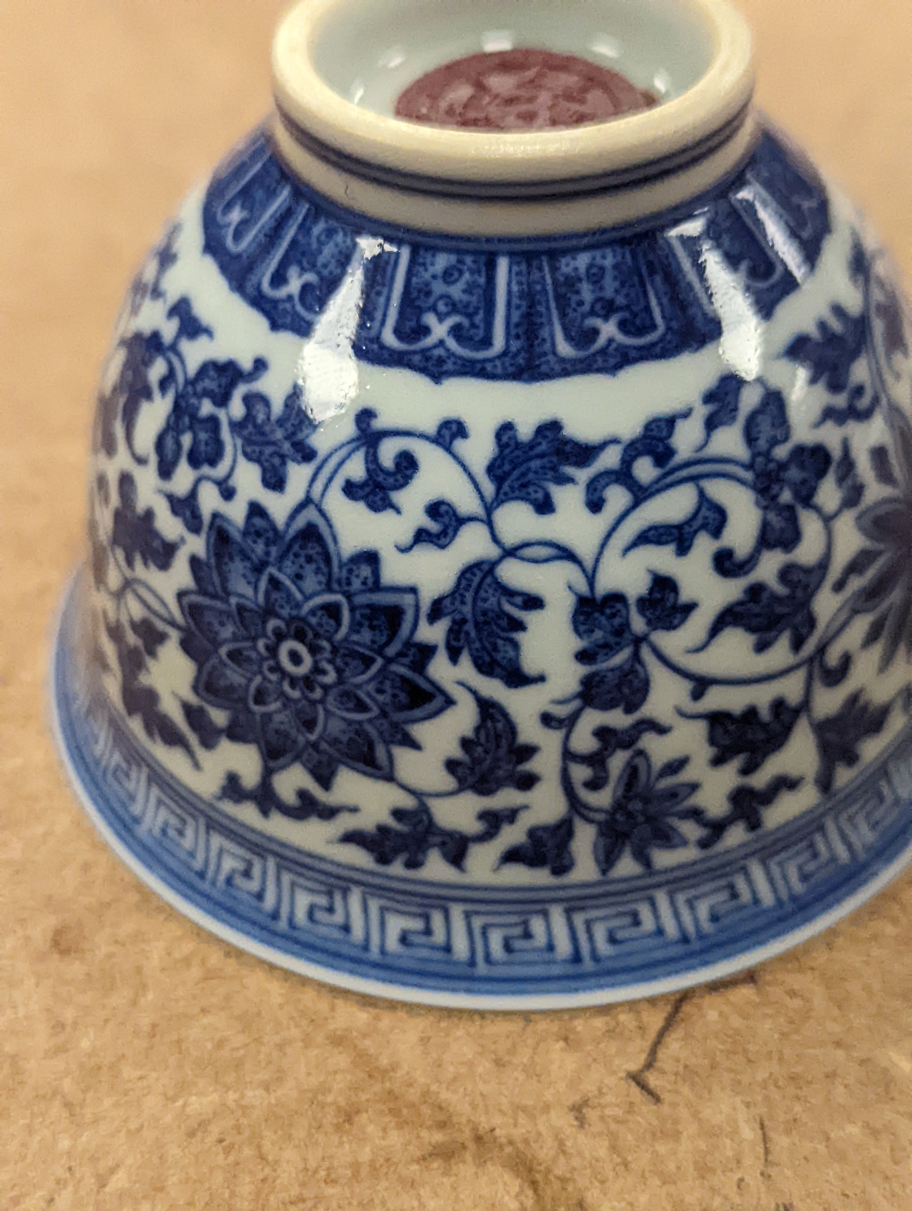 A Chinese blue and white 'lotus' cup. 9cm diameter